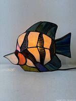 Left side view of illuminated stained glass angelfish lamp