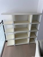 Front view of white five-tier shelving unit