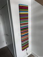 Full view of the stripe wall art hung on wall