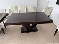 Full view of table showing top and base, visible wear