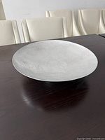 Top view of hammered silver bowl on table