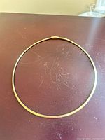 Necklace laid flat showing full shape and clasp