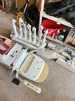 Seat unit, rail sections, brackets, wiring visible