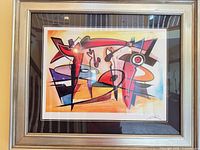 Full view of framed print under glass