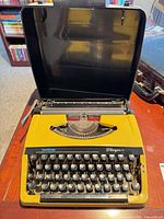 Typewriter in open carrying case showing full unit