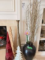 All six decor pieces grouped beside fireplace