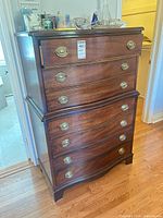 Front view of the Dixie dark brown chest of drawers showing overall design and drawer layout