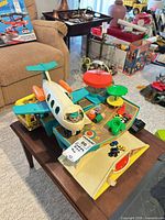 Overall view of airport playset with airplane, buses, cars and figures