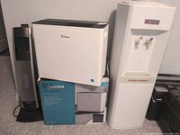 Group shot of dehumidifier, heater and water cooler