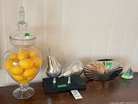 Group view of all four decorative items on shelf