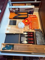Drawer view showing all utensils and cutlery