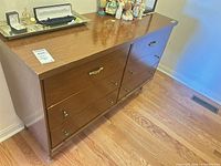 overall view of walnut dresser showing six drawers and hardware