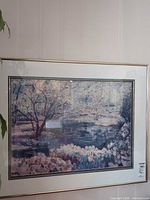 Full view of framed painting with mat and metallic frame