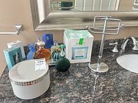 All fragrance items and decorative bottles grouped on countertop with boxes visible