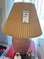 Full lamp with shade showing color, form and size tag