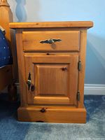 Front view showing drawer, cabinet door, hardware, overall design