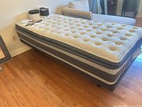 Full view of Twin XL pillow-top mattress on adjustable base