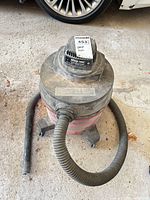 Overall view of Shop-Vac with hose and wand