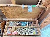 Open toolbox showing interior trays and mixed contents