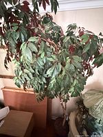 Upper foliage showing green and burgundy silk/PVC leaves