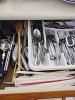 Drawer with flatware tray, serving utensils, wooden spoons and spatulas