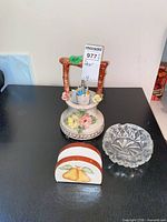 Group shot of Bassano figurine, cut glass ashtray and ceramic napkin holder