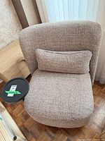 Top view of the tweed upholstered accent chair with lumbar cushion