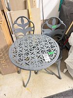 Table and two chairs showing overall style and condition