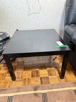 Front view of black square end table