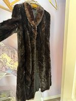 Full view of mink coat hanging to show length and fur texture