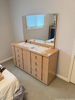 front view of dresser with attached mirror, shows finish and hardware