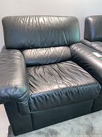 Front view of black leather armchair
