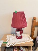 Burgundy ceramic table lamp with pleated shade