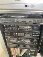 Full stack of Kenwood and Sanyo stereo components in rack