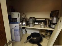 Overview of all kitchen items inside cabinet