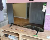 Front view of LG 43" TV on stand