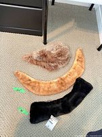 Three fur collars laid out showing colors and size labels