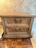 Front view showing two drawers and hardware