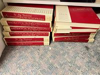 Stacks of The Illustrated Columbia Encyclopedia volumes on shelf