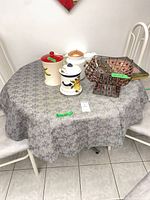 Table with tablecloth and other items on top