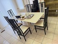 Full set of 7 chairs around dining table showing design and upholstery