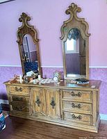 Front view of dresser with two mirrors attached