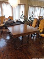 Full view of dining table top and base in room