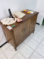 Full view of cabinet showing top, doors, drawers, and overall condition