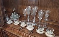 Full view of demitasse sets, cruet, assorted tall stemware