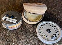 Reel, spare spool, open case showing interior