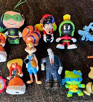 Close-up centre showing figures Marvin, Lola, Frankenstein, Hello Kitty, Oogie Boogie and vehicle toys