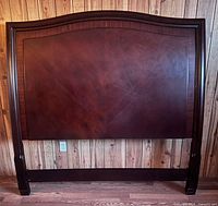 Full view of dark wood queen headboard front
