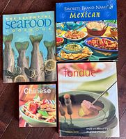 Front covers of all four cookbooks