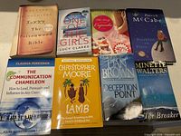 All eight books laid out, showing titles and formats